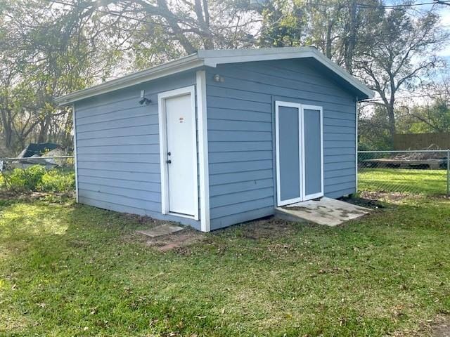 view of shed with fence