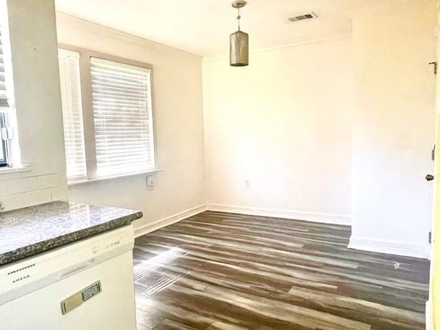 unfurnished dining area with baseboards and dark wood finished floors