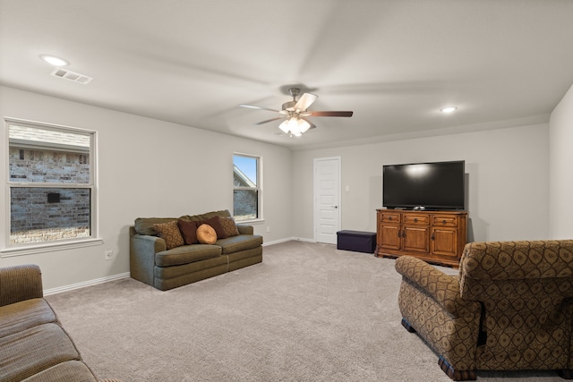 carpeted living room featuring ceiling fan