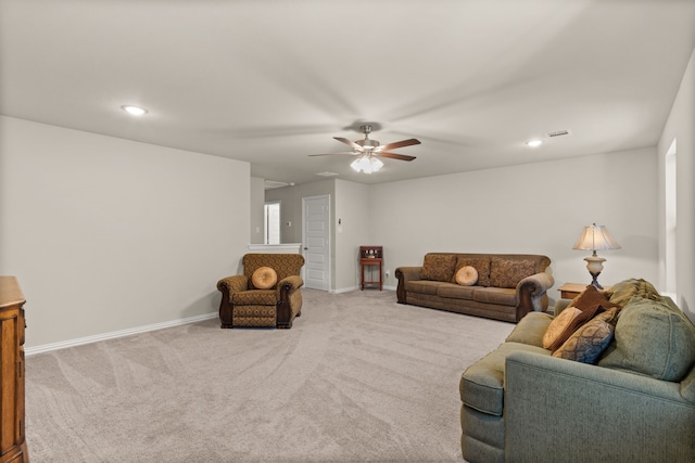 living room featuring ceiling fan and light colored carpet