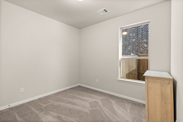 empty room with carpet flooring