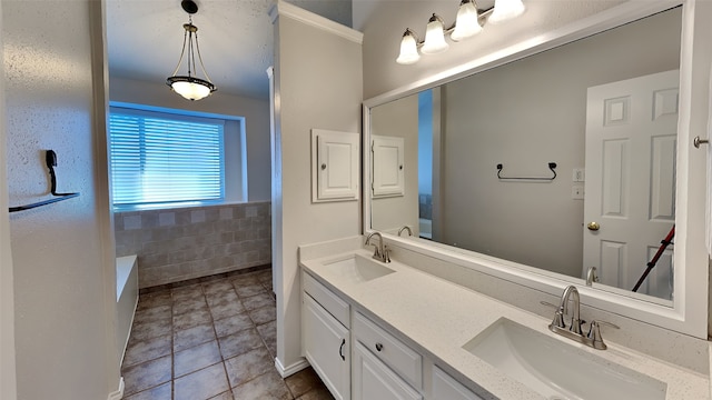 bathroom featuring a bathtub, tile patterned flooring, and vanity