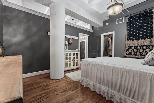 bedroom with dark hardwood / wood-style floors and a closet