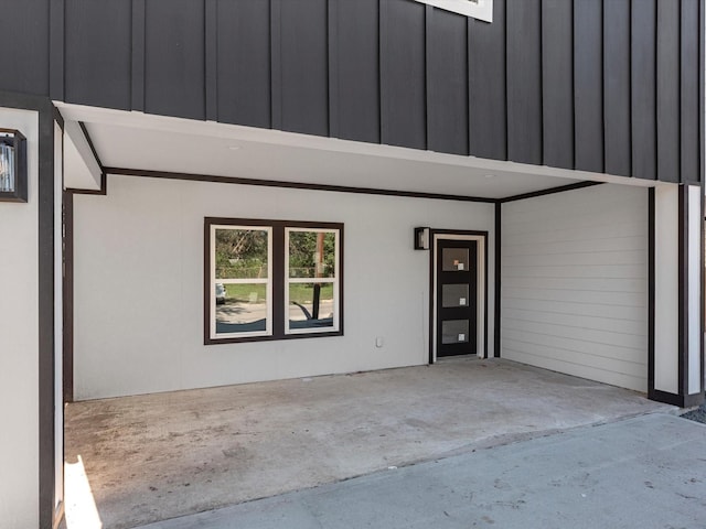 property entrance featuring a patio area