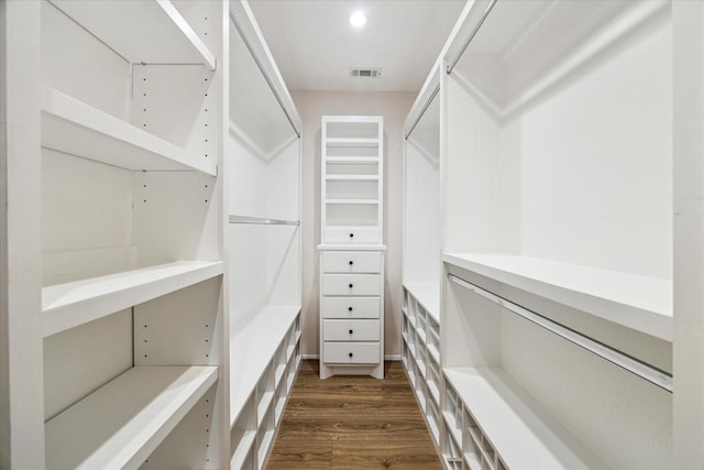 walk in closet featuring dark hardwood / wood-style flooring