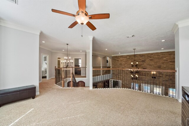 living room featuring a textured ceiling, an inviting chandelier, carpet flooring, and ornamental molding