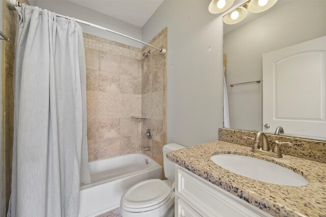 full bathroom featuring toilet, shower / tub combo, and vanity