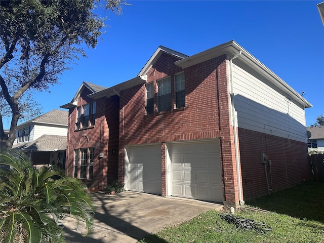 view of side of home with a garage