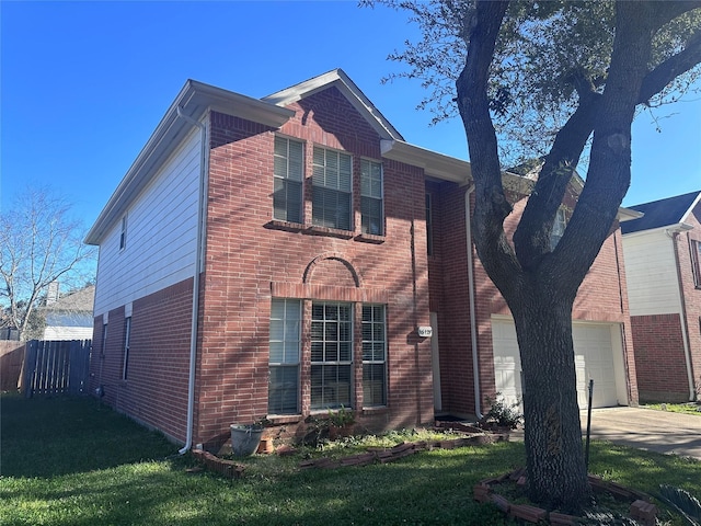 view of front of home featuring a garage and a front lawn