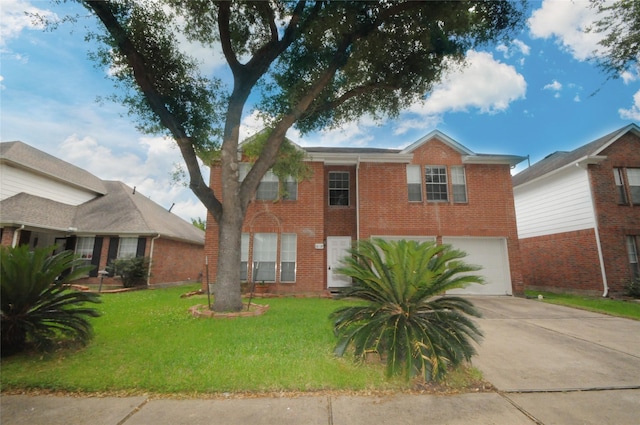 traditional-style home with concrete driveway, a front yard, brick siding, and a garage