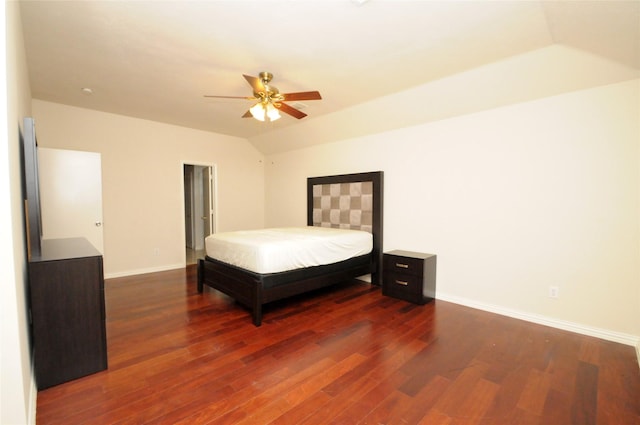 bedroom with lofted ceiling, ceiling fan, dark wood-style floors, and baseboards