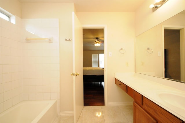 ensuite bathroom with a healthy amount of sunlight, connected bathroom, a ceiling fan, and tile patterned flooring