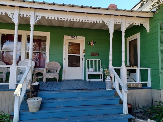 doorway to property with a porch