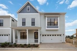 view of front facade featuring a garage and covered porch