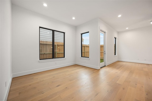 spare room with light wood-type flooring