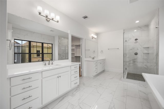 bathroom with vanity and separate shower and tub