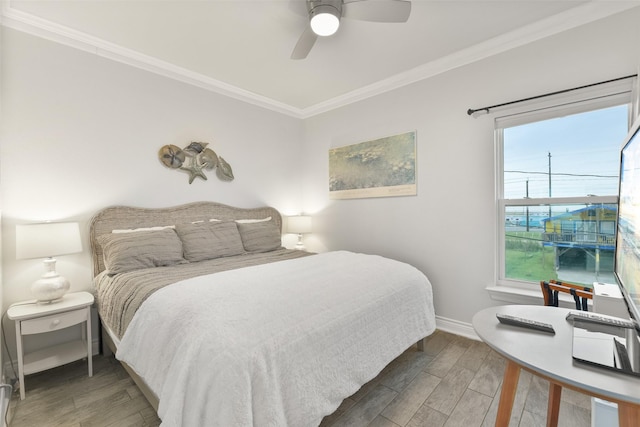 bedroom with baseboards, ornamental molding, dark wood finished floors, and a ceiling fan