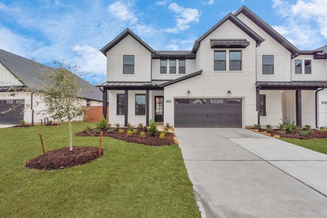 modern farmhouse style home with concrete driveway, an attached garage, a standing seam roof, a front lawn, and board and batten siding