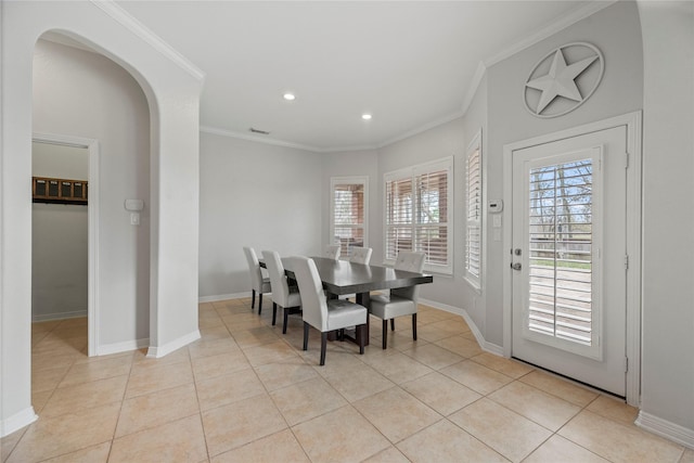 tiled dining space with crown molding