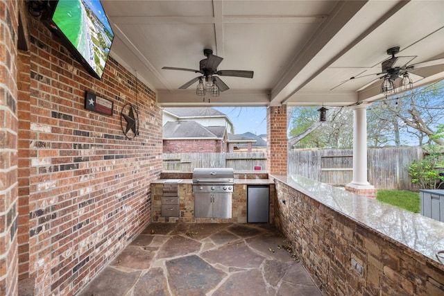 view of patio / terrace with ceiling fan, exterior kitchen, and area for grilling