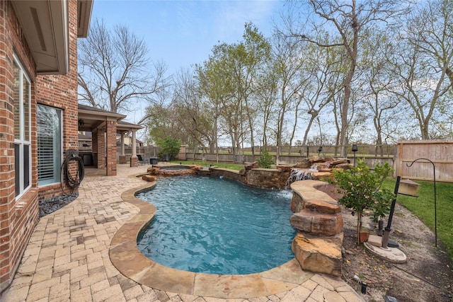 view of swimming pool with an in ground hot tub and a patio