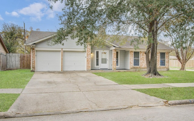 single story home featuring a garage and a front yard