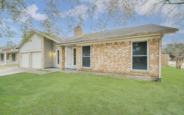 ranch-style house with a garage and a front lawn