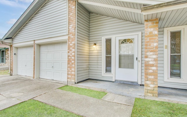 view of exterior entry featuring a garage