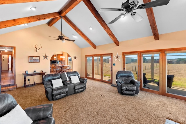 living room featuring beamed ceiling, ceiling fan, high vaulted ceiling, and carpet