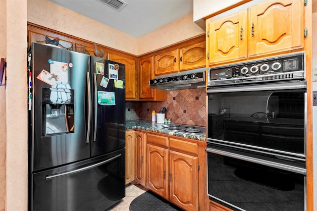 kitchen with stainless steel gas cooktop, refrigerator, black double oven, range hood, and backsplash