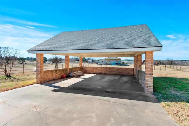 view of parking with a rural view and a gazebo