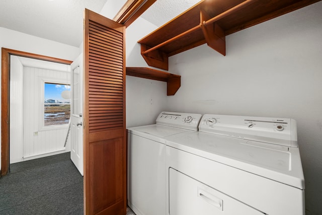 washroom with dark colored carpet and independent washer and dryer