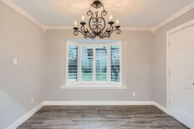 unfurnished dining area with an inviting chandelier, crown molding, and a wealth of natural light