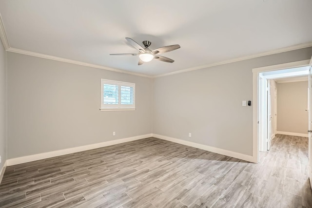 spare room with ornamental molding, ceiling fan, and light wood-type flooring