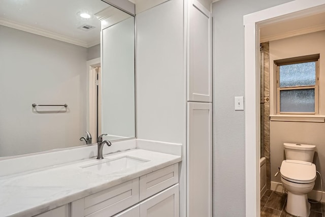 full bathroom featuring crown molding, vanity, toilet, and tub / shower combination