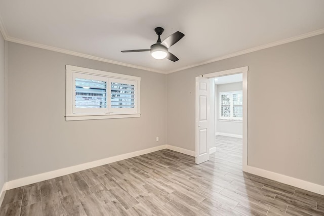 unfurnished room featuring crown molding, ceiling fan, and light wood-type flooring