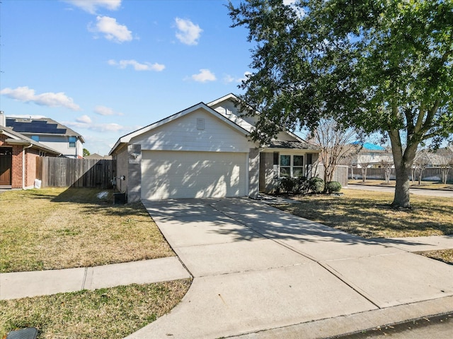 view of front of property with a garage and a front lawn