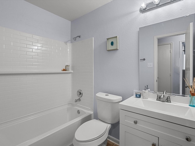 full bathroom with tiled shower / bath combo, vanity, and toilet