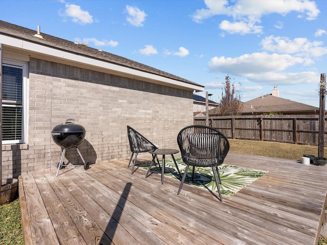 wooden deck featuring area for grilling