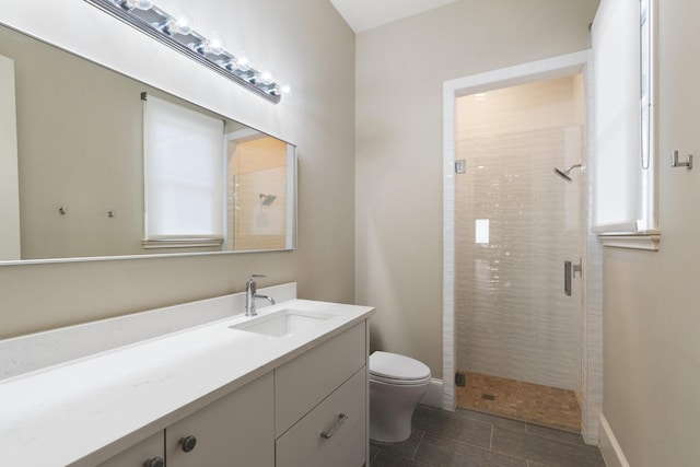 bathroom with vanity, toilet, and walk in shower