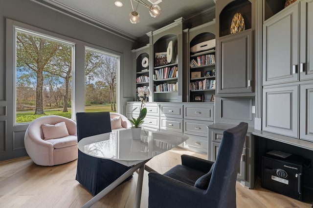 interior space with ornamental molding and light hardwood / wood-style floors