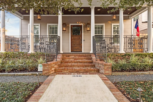 doorway to property with covered porch