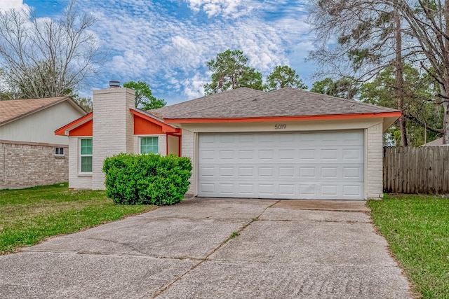 ranch-style home featuring a garage and a front lawn