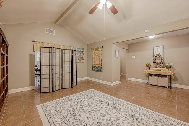 interior space featuring ceiling fan, tile patterned floors, and lofted ceiling with beams