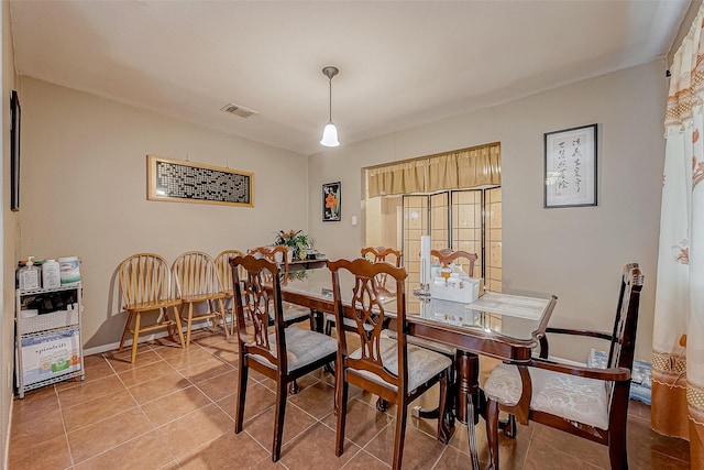 dining space with tile patterned floors