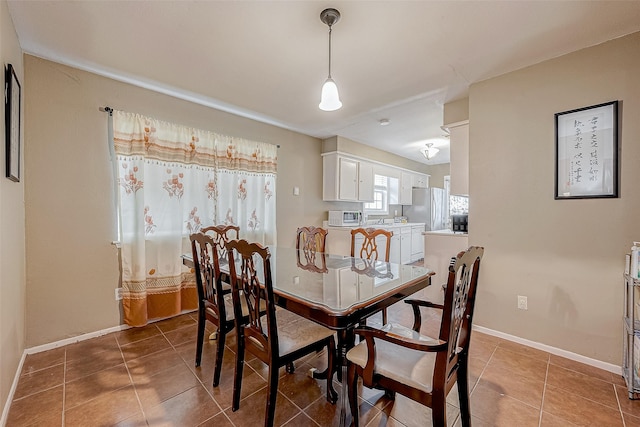 view of tiled dining space