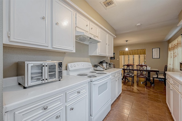 kitchen featuring decorative light fixtures, white cabinets, electric range, and tile patterned floors