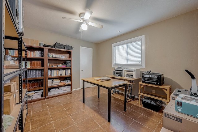 home office with light tile patterned flooring and ceiling fan