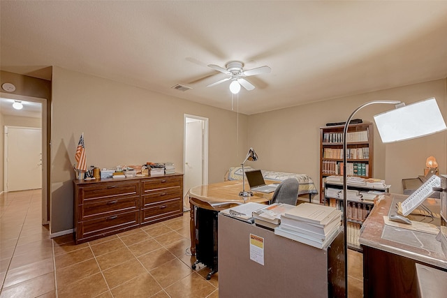 home office with ceiling fan and light tile patterned flooring