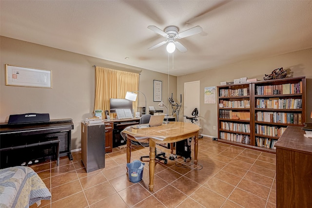 office space featuring ceiling fan, tile patterned floors, and a textured ceiling